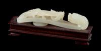 A Carved White Jade Belt Hook Length 3 3/4 inches. — 18TH/19TH CENTURY