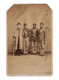 [CIVIL WAR]. CDV of an African American sergeant and private posed with white soldiers in a studio. Philadelphia, PA: O.H. Willard, ca 1864-1865.