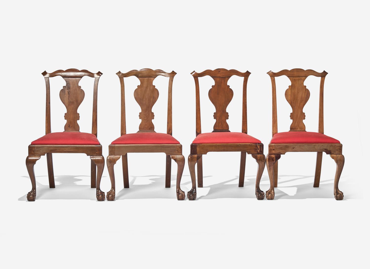 A Set of Four Chippendale Walnut Claw-and-Ball Foot Dining Chairs