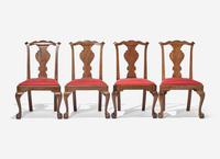 A Set of Four Chippendale Walnut Claw-and-Ball Foot Dining Chairs