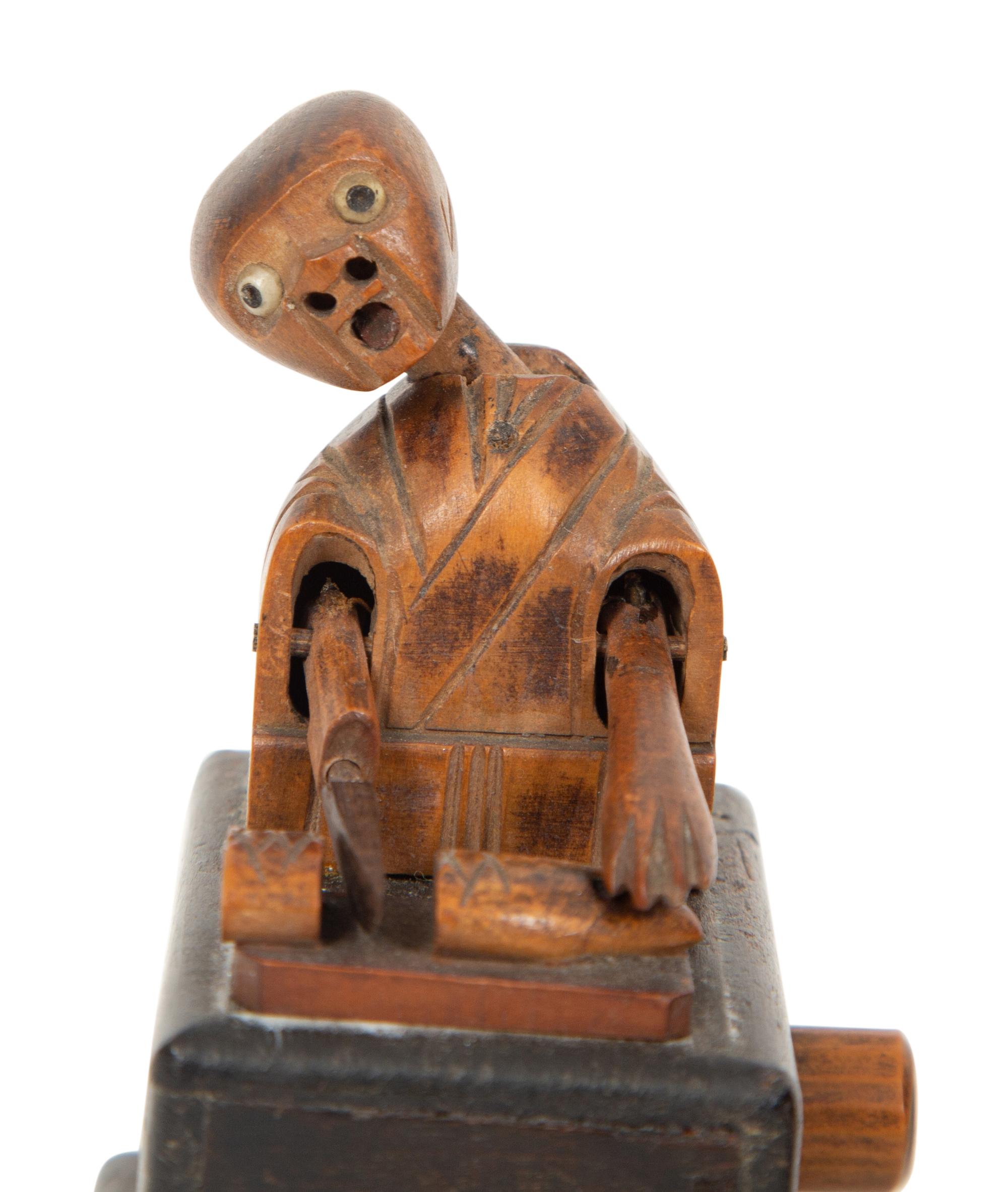 Two Japanese Carved Wood Kobi Ningyo Automatons and a Silver Mounted Gourd