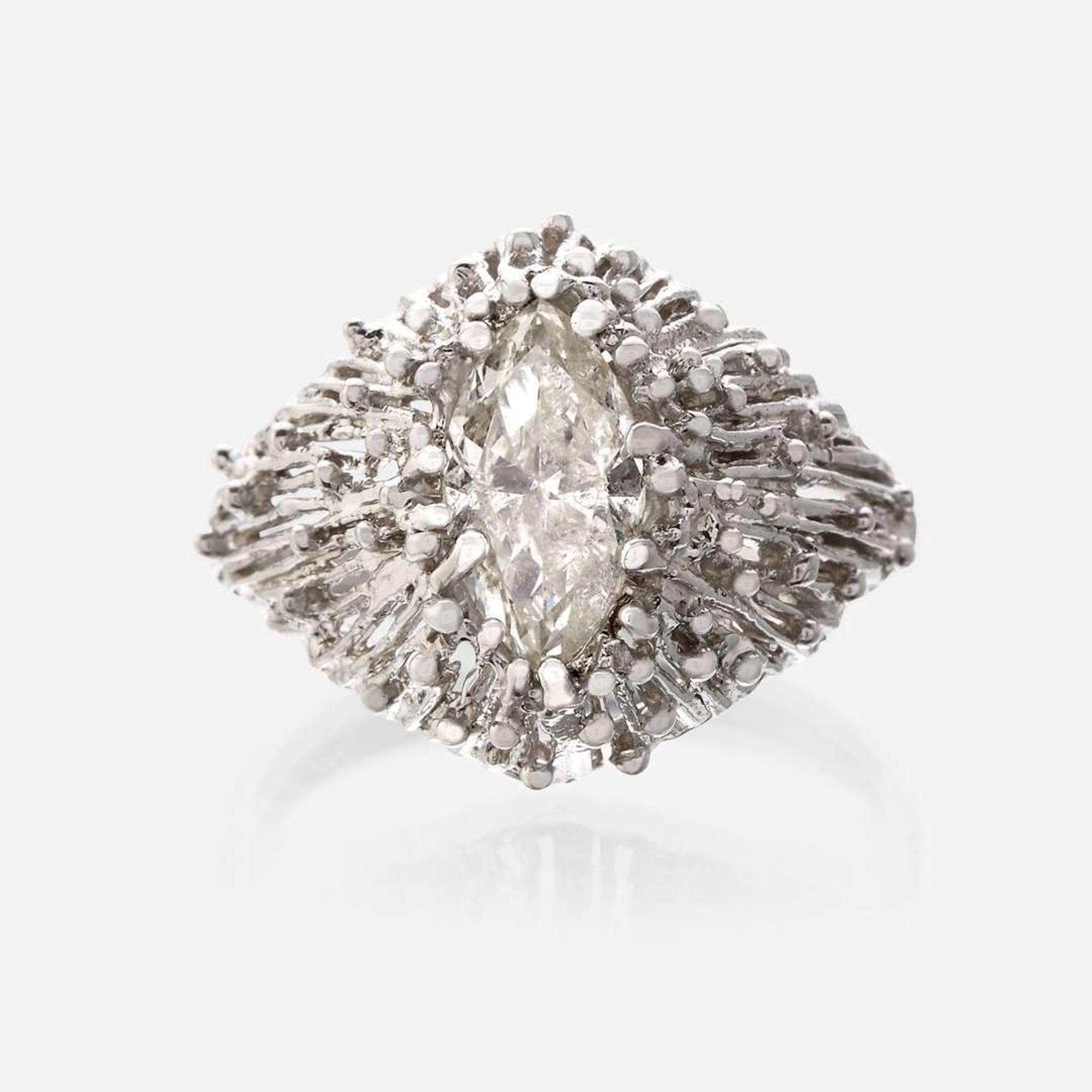 An eighteen karat gold and diamond ring