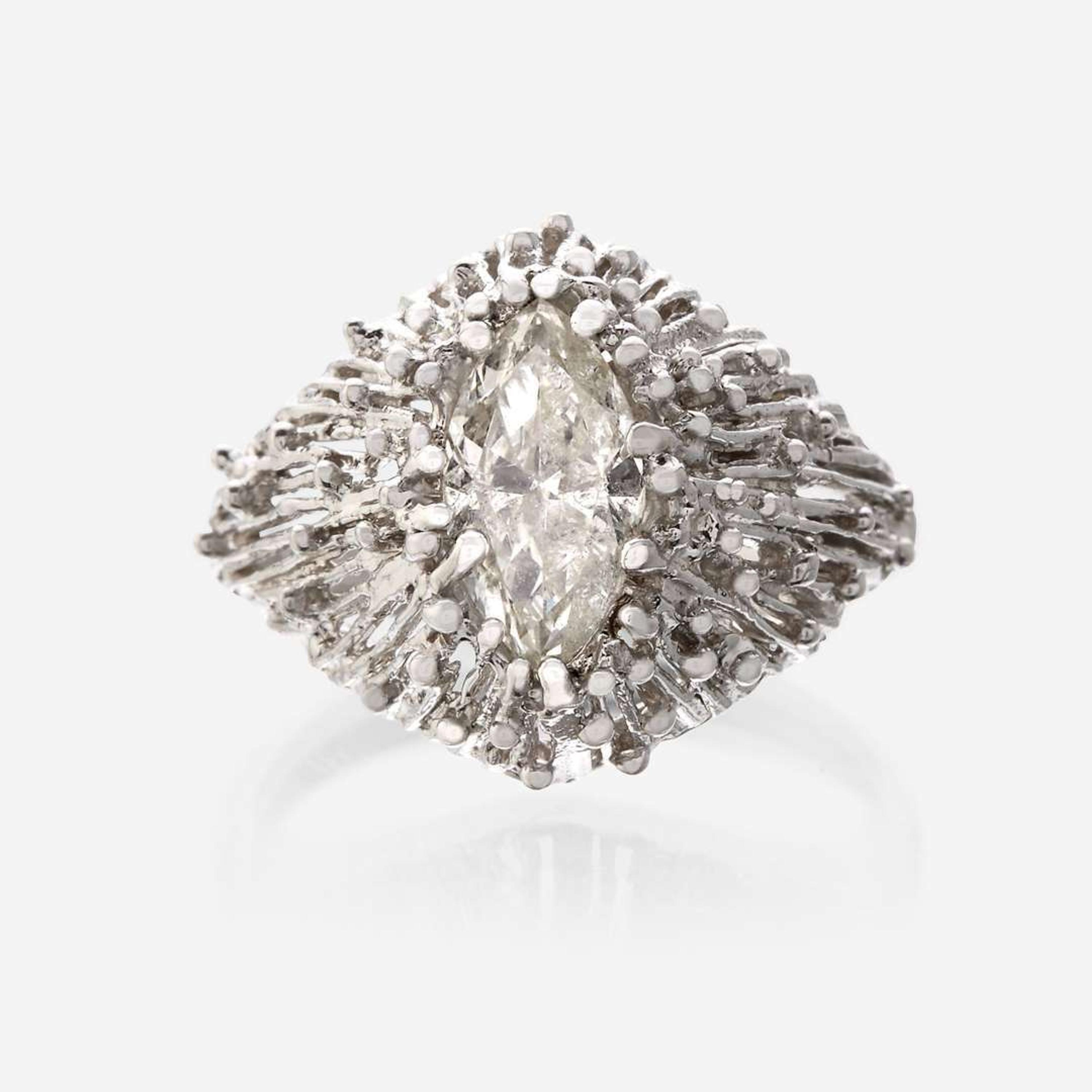 An eighteen karat gold and diamond ring