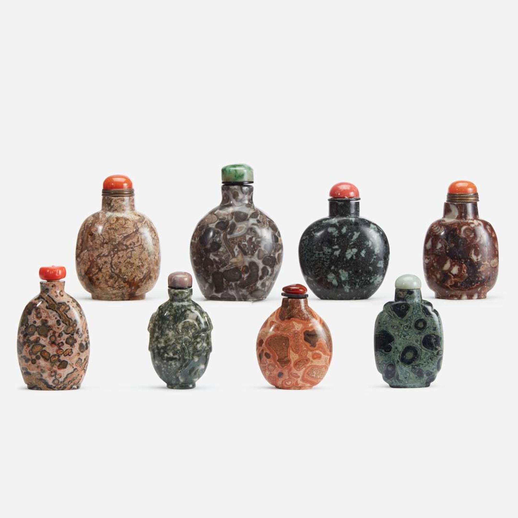A group of eight Chinese assorted conglomerate and patterned stone snuff bottles