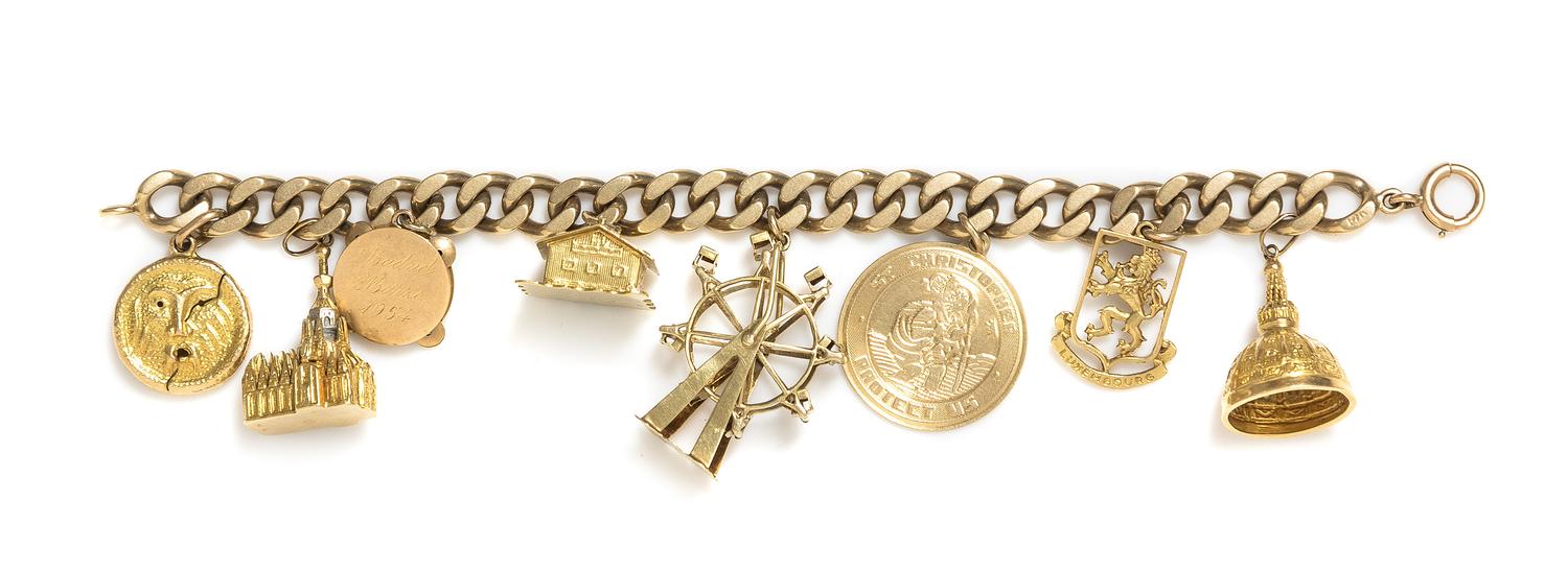 A 14 Karat Yellow Gold Bracelet with Eight Attached Charms, 41.50 dwts.