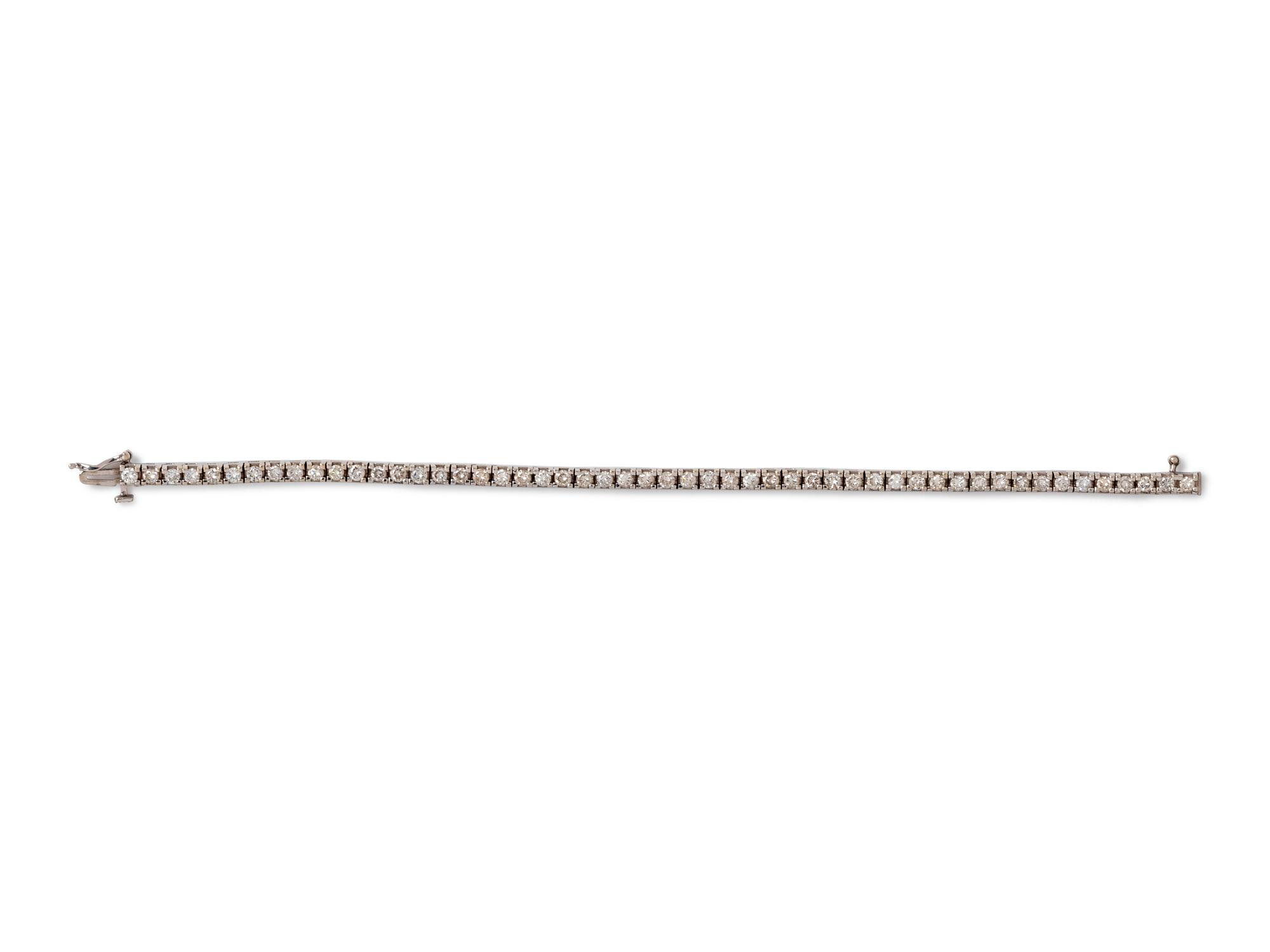 A 14 Karat White Gold and Diamond Line Bracelet,