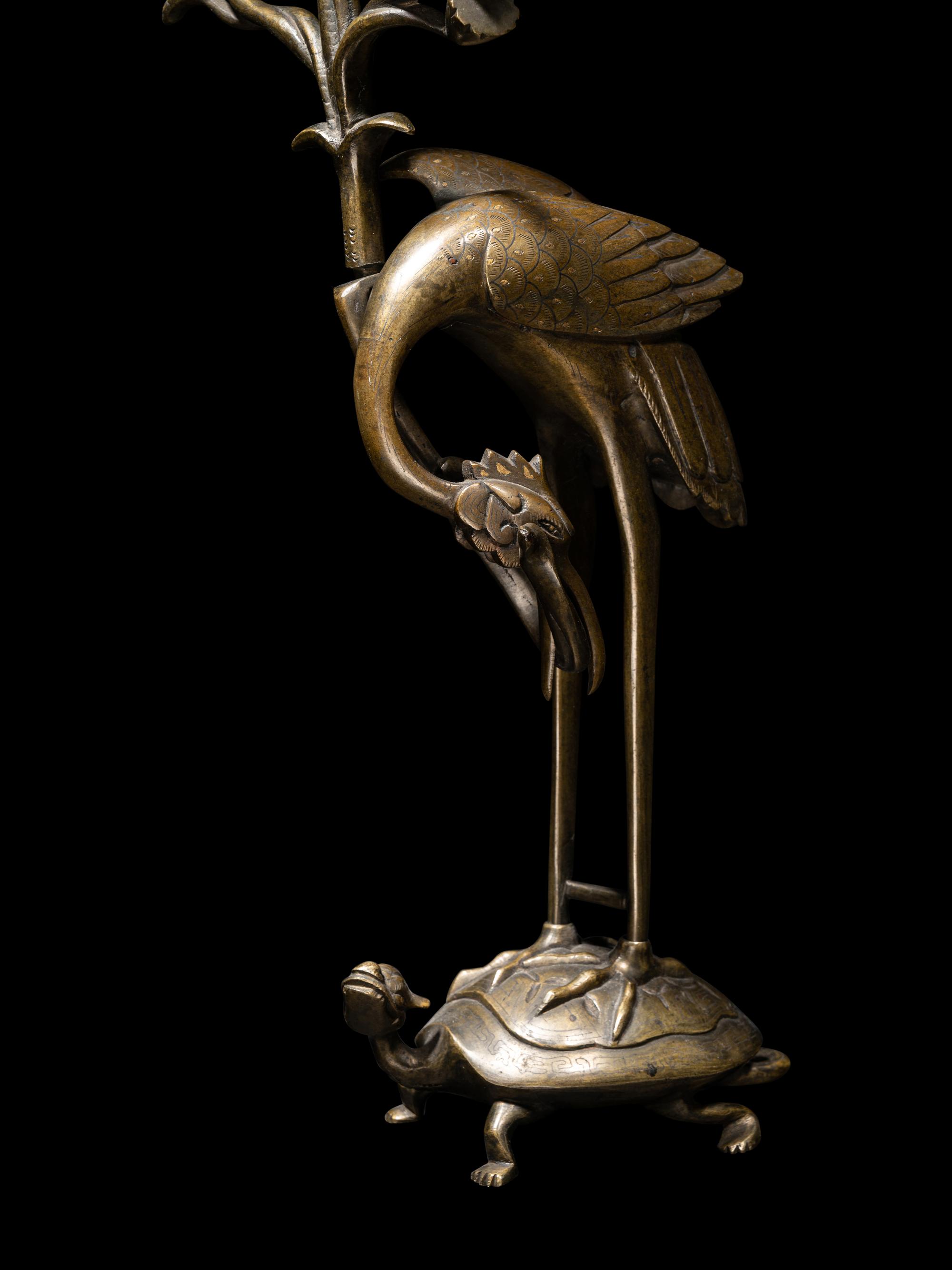 Three Chinese Bronze 'Turtle and Crane' Candle Holders