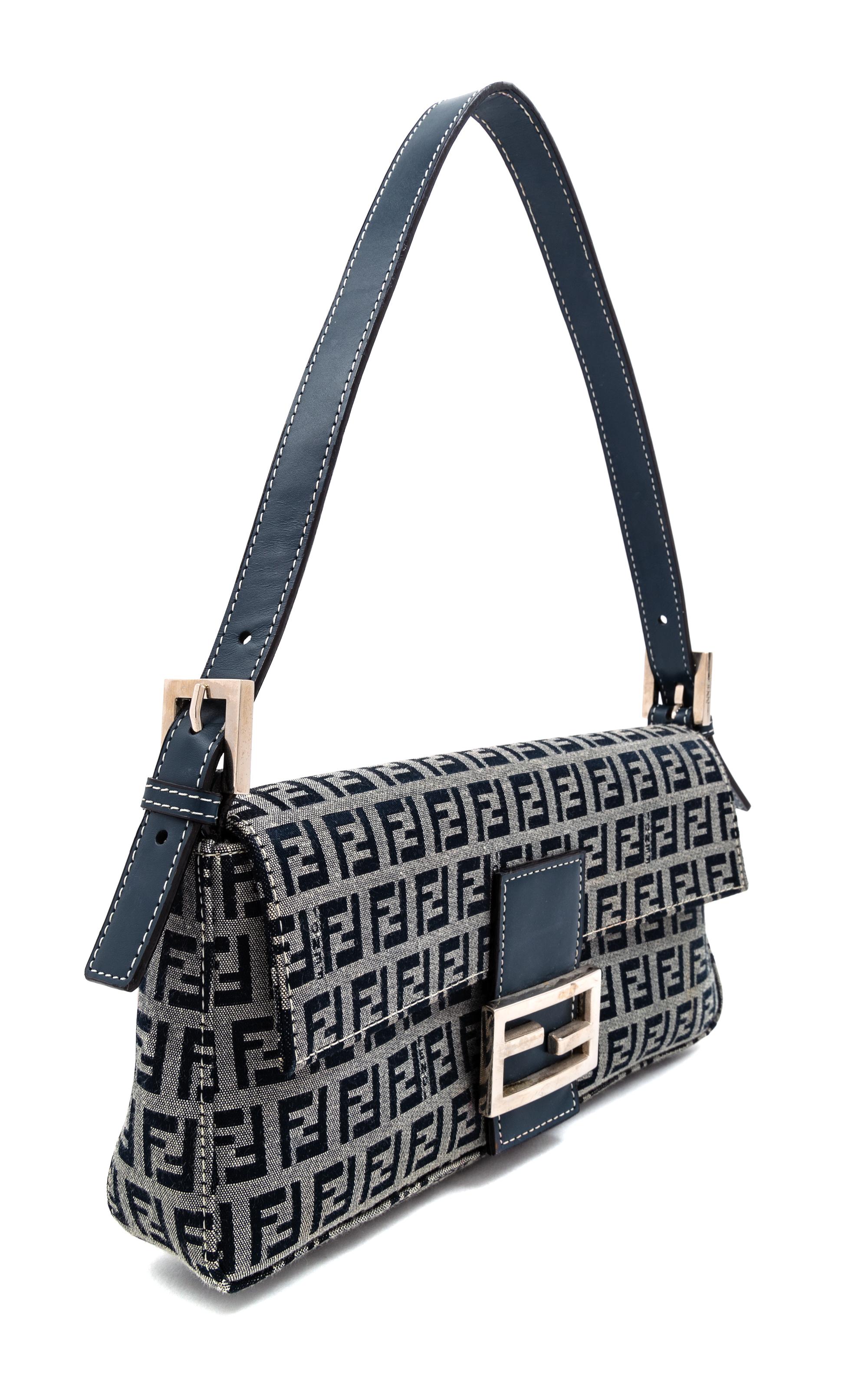 A Fendi Navy Monogram Canvas Zucca Baguette, 5" H x 10.25" W x 1.75" D; Strap drop: 6.5"- 9.5".