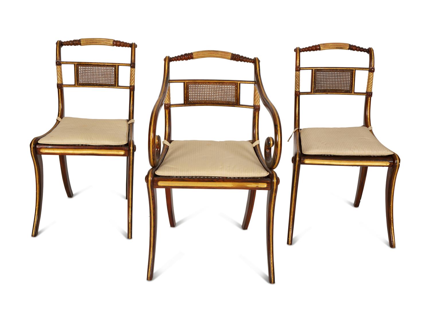 A Set of Fourteen Regency and Regency Style Rosewood and Parcel Gilt Dining Chairs