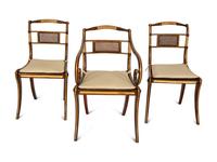 A Set of Fourteen Regency and Regency Style Rosewood and Parcel Gilt Dining Chairs