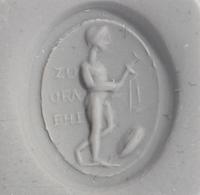 A Roman Gold and Plasma Finger Ring with a Figure Holding Tools and an Inscription