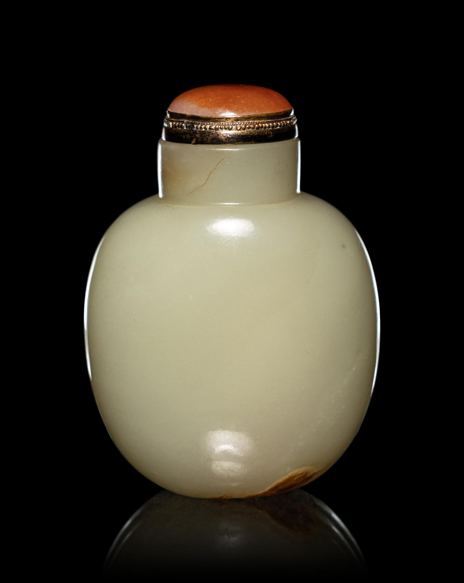 A Carved Russet and Celadon Jade Snuff Bottle