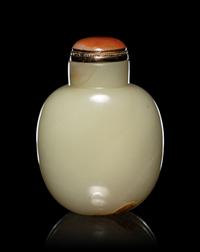 A Carved Russet and Celadon Jade Snuff Bottle