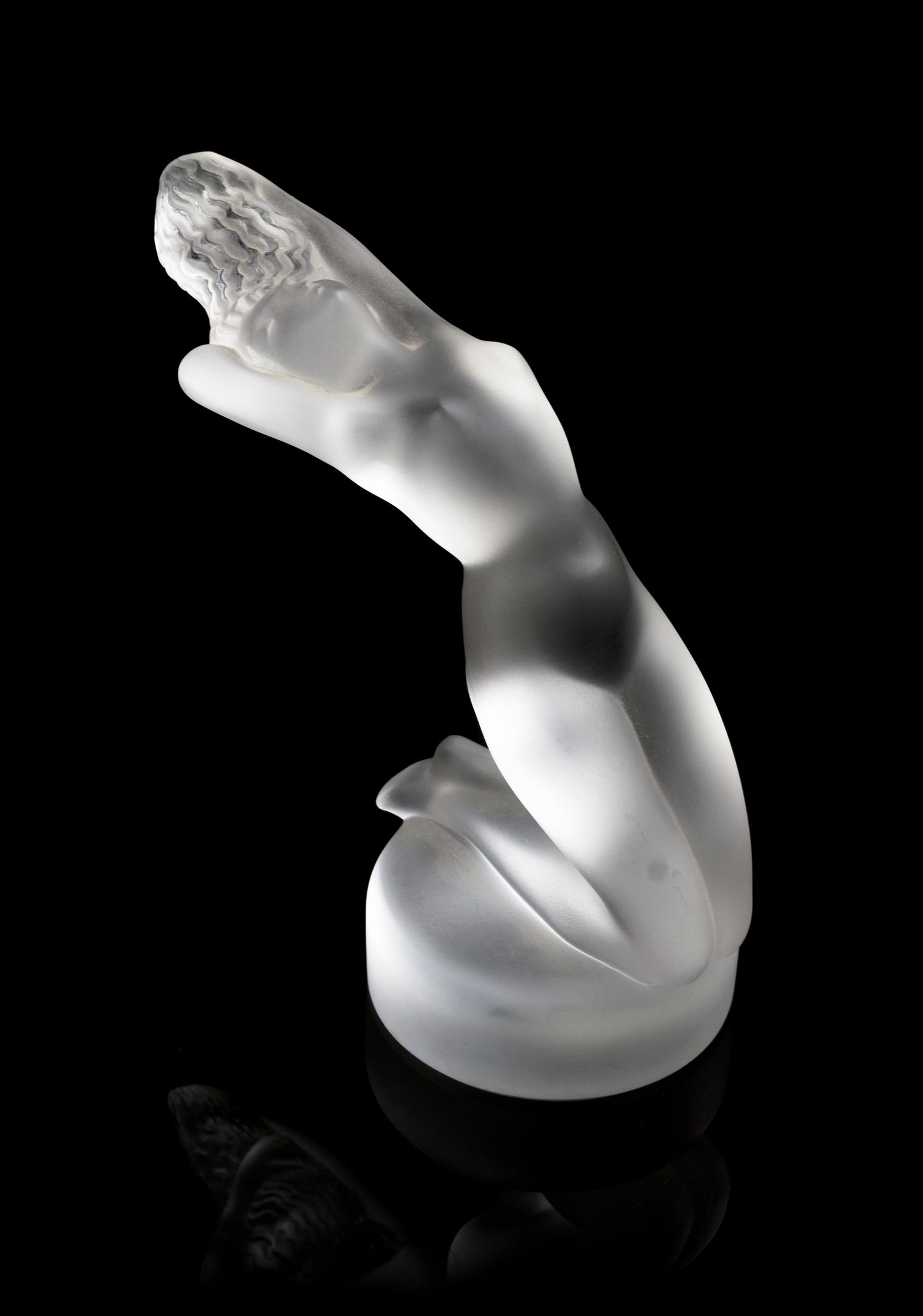 A Lalique Molded and Frosted Glass Figure, Height 5 3/4 inches.