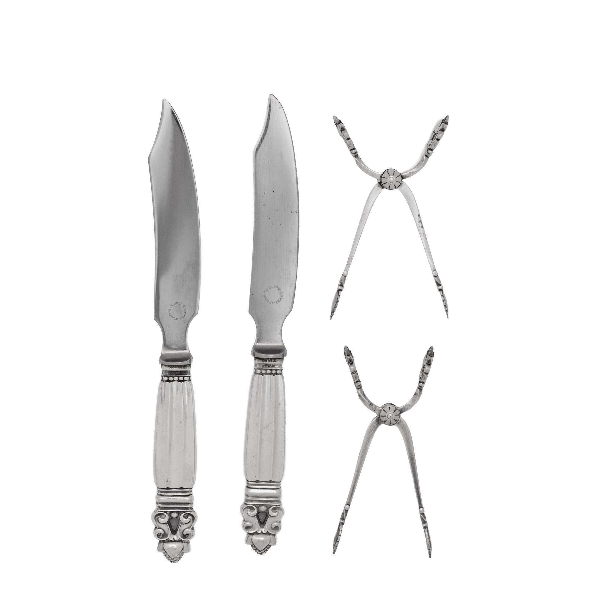 A Pair of Georg Jensen Acorn Silver Cheese Knives and a Pair of Sugar Tongs