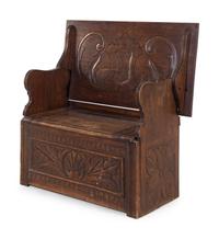 A Jacobean Style Carved Oak Metamorphic Monks Settle