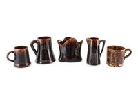 Nine Table Articles in Brown and Bennington Style Glaze