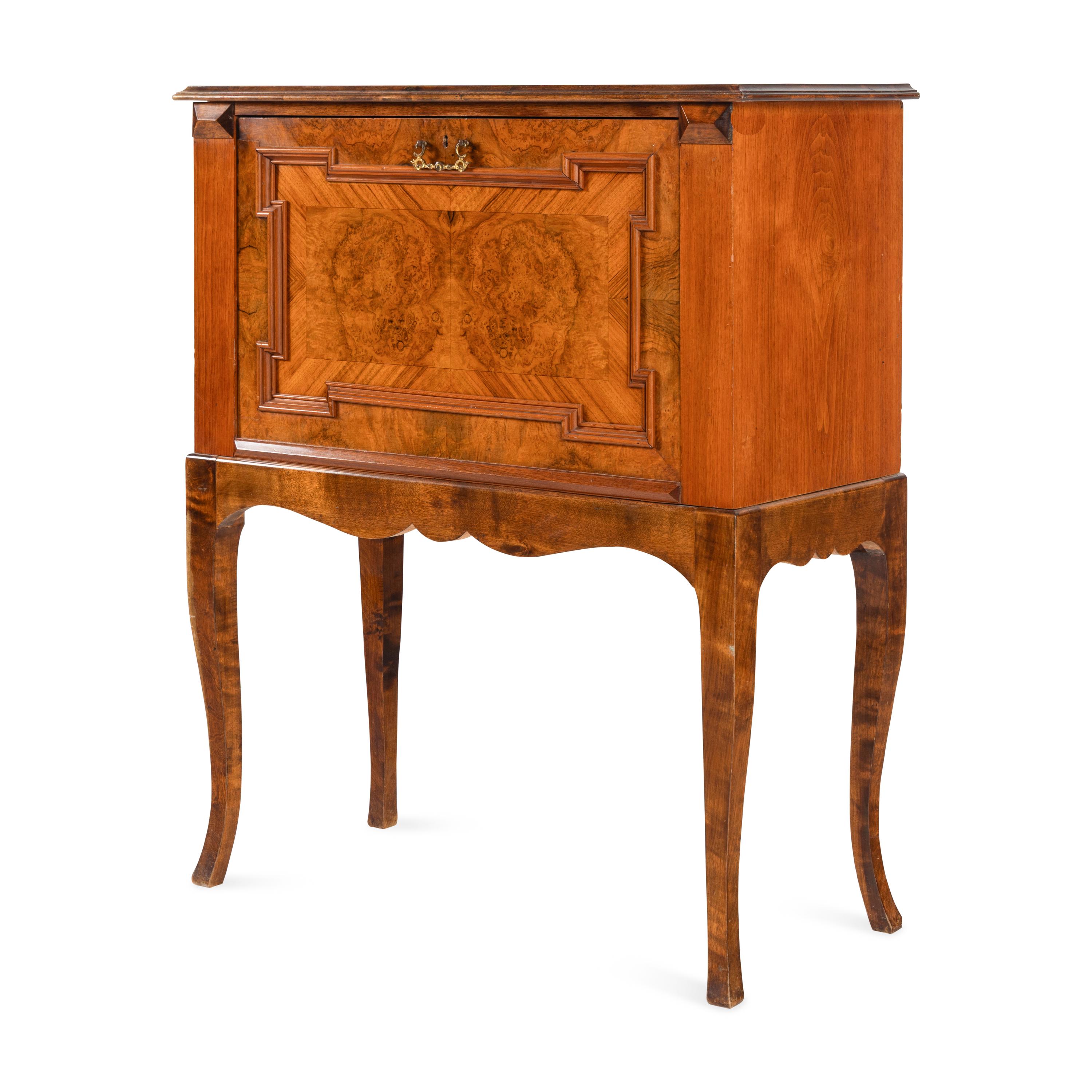 A Continental Carved and Figured Walnut Bureau