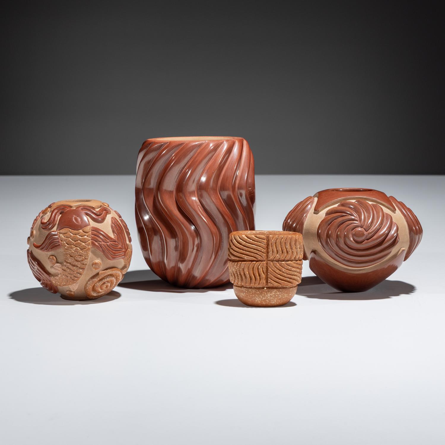 Red and Tan Carved Pottery