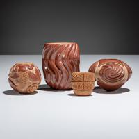 Red and Tan Carved Pottery