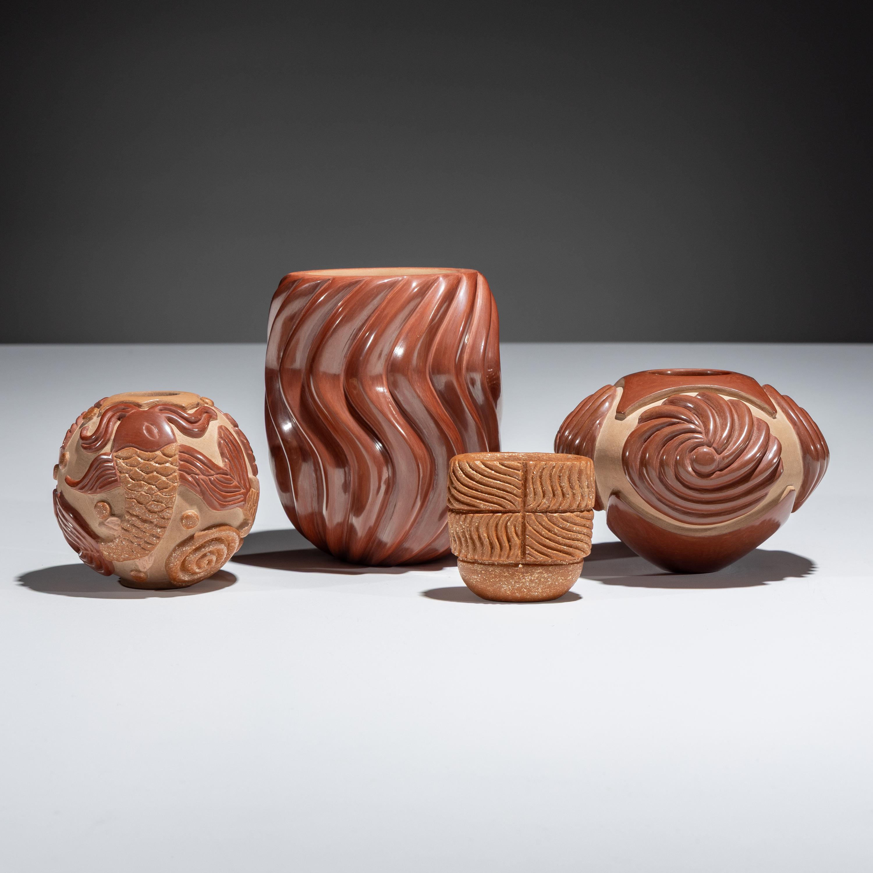 Red and Tan Carved Pottery