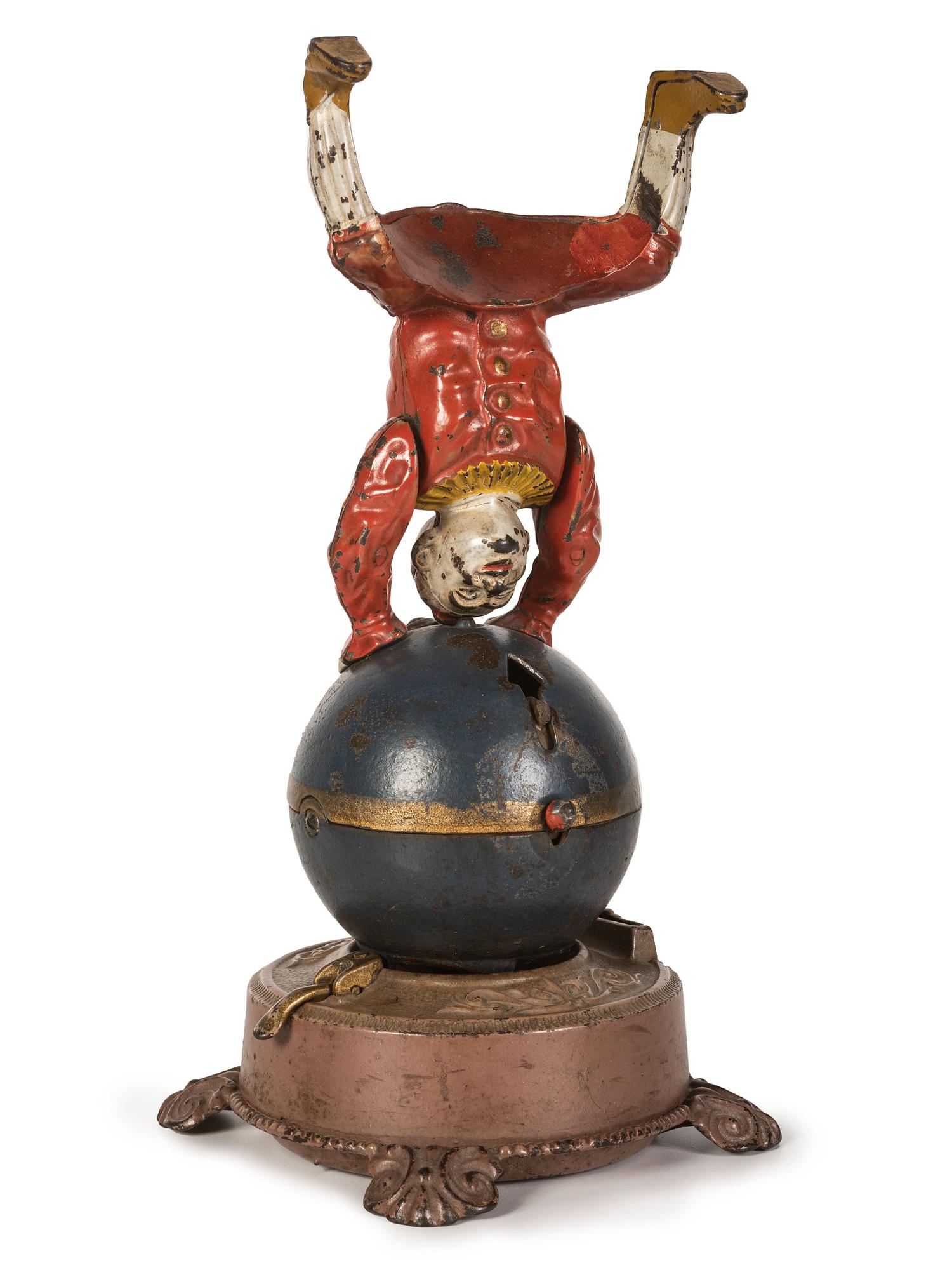 A Spinning Clown on Globe Cast Iron Mechanical Bank