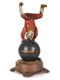 A Spinning Clown on Globe Cast Iron Mechanical Bank