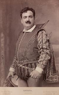 CARUSO, Enrico (1873-1921). Black and white promotional photograph signed ("Enrico Caruso London 1905?").