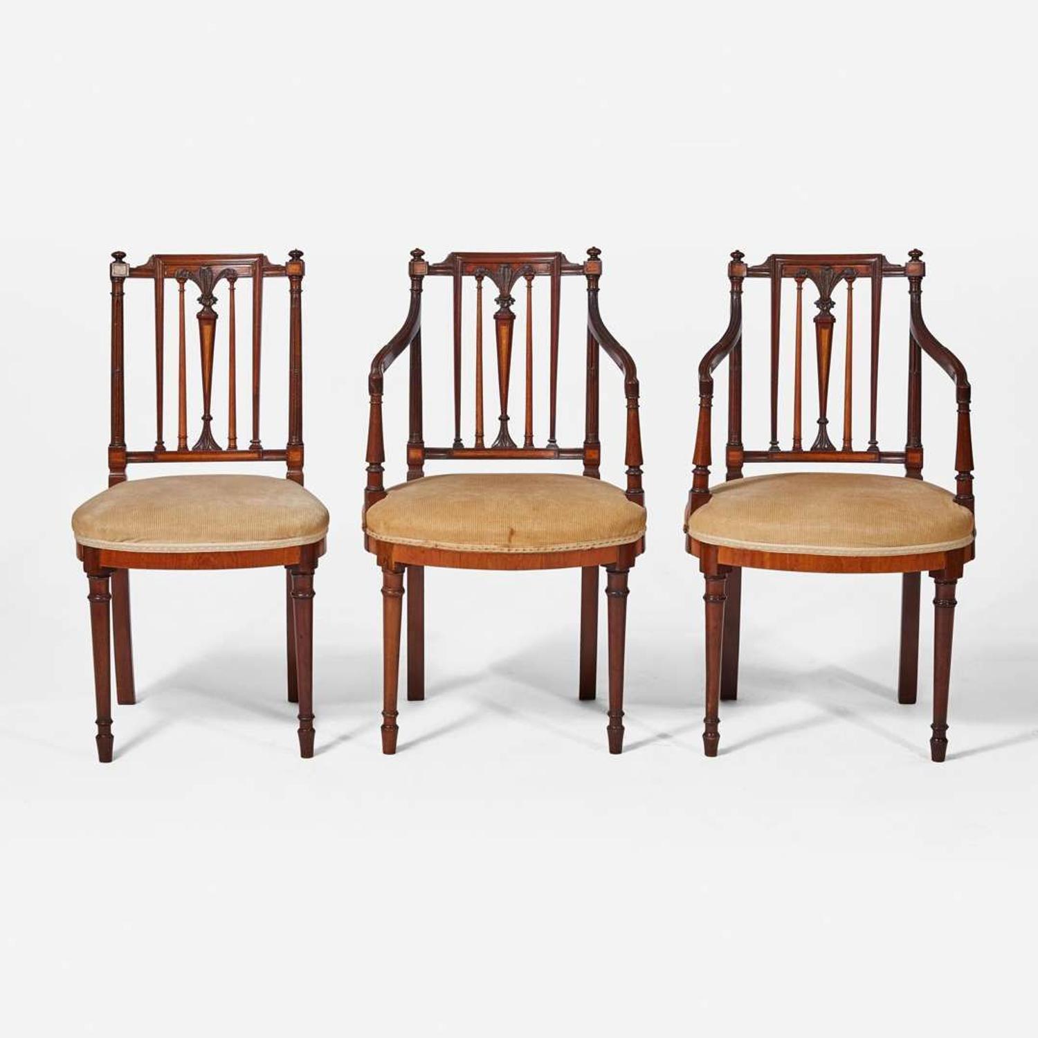 A group of three George III inlaid mahogany and satinwood dining chairs circa 1790