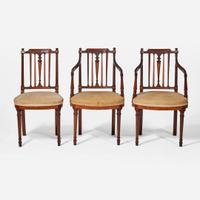 A group of three George III inlaid mahogany and satinwood dining chairs circa 1790