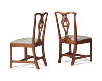 A Pair Of Chippendale Carved Mahogany Side Chairs