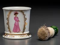 A Porcelain Shaving Mug Depicting a Fashionable Lady