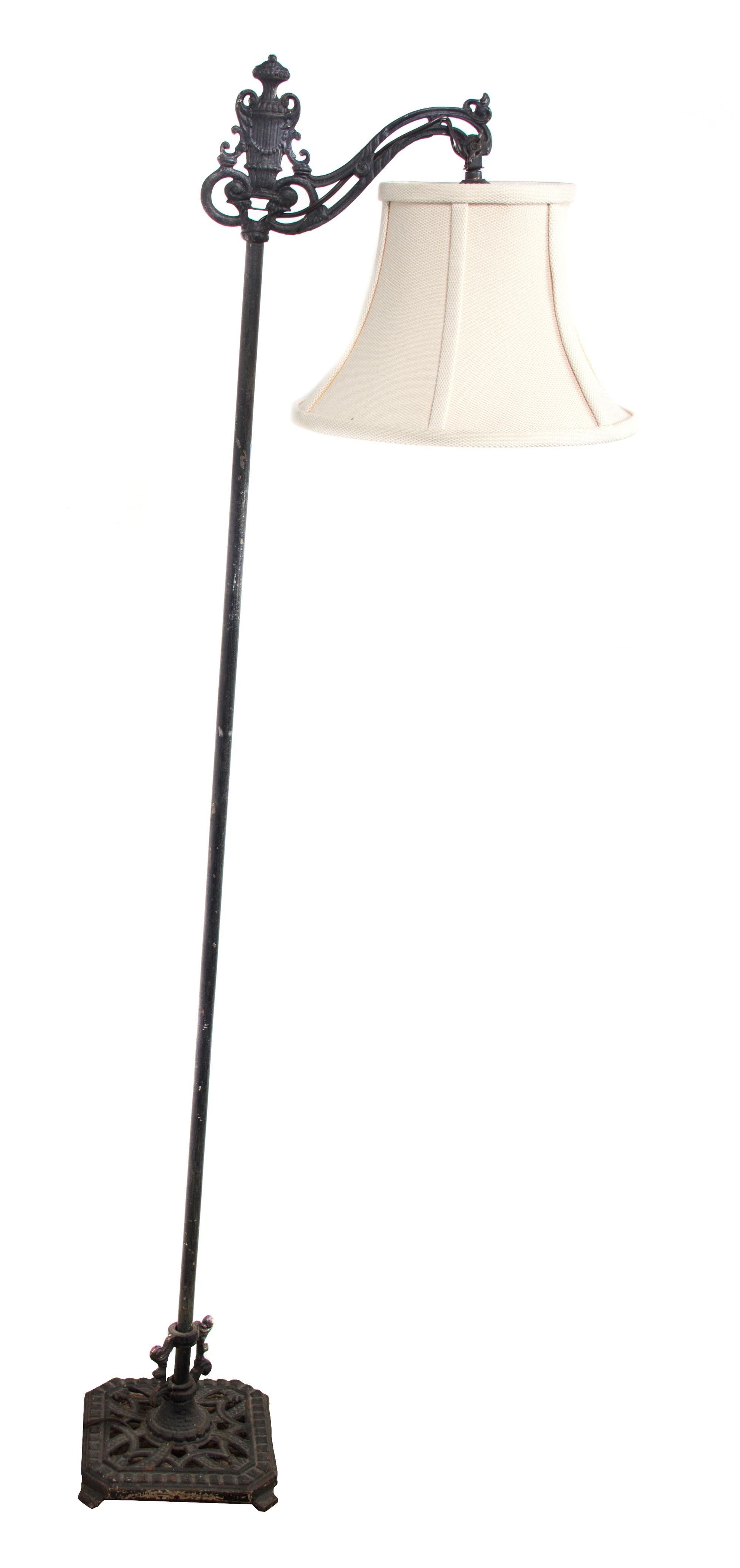A Black Painted Metal Floor Lamp — 20TH CENTURY