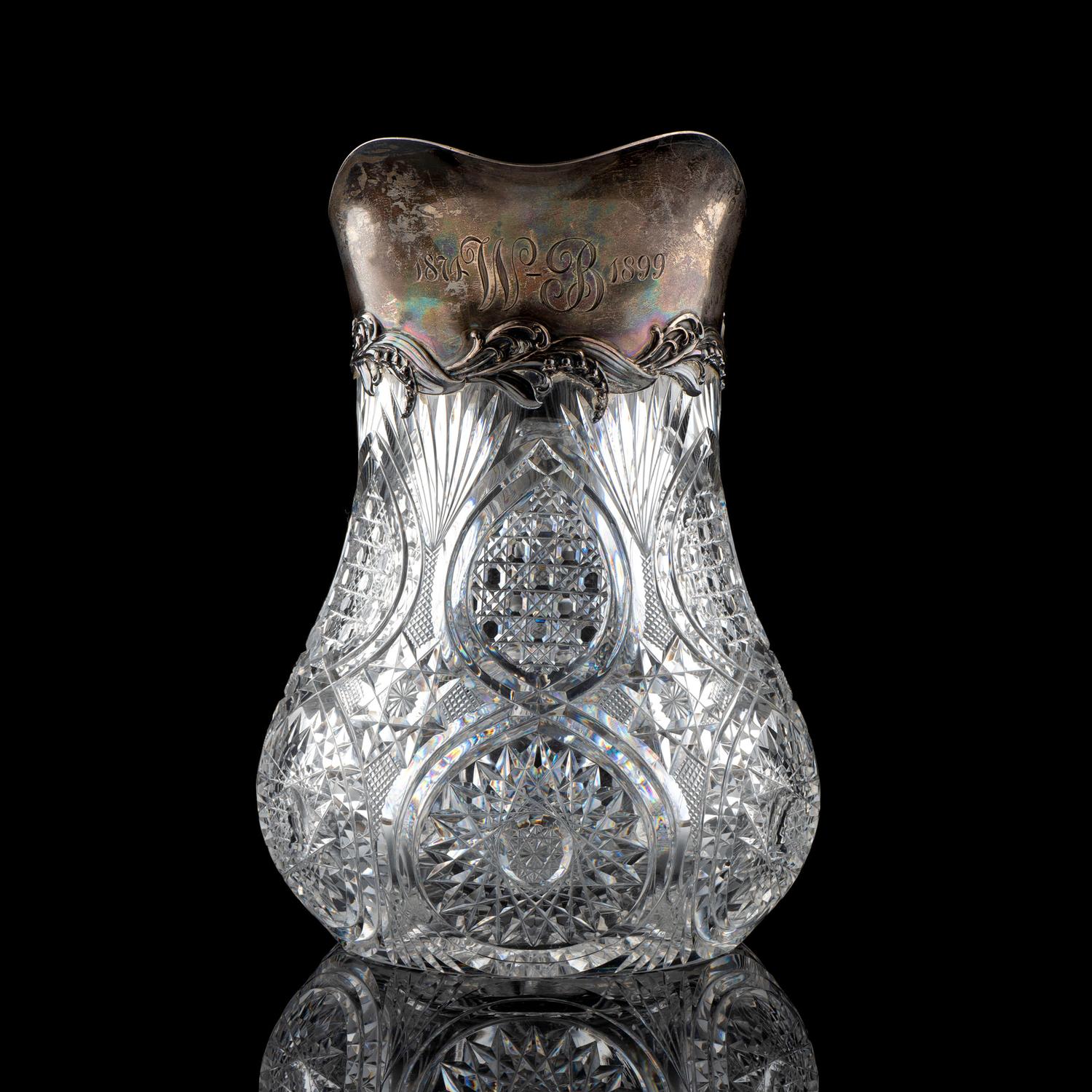 A Brilliant-Period Cut Glass Water Pitcher with Lilies of the Valley and a Silver Mount