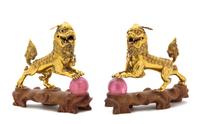 A Pair of Chinese 14 Karat Gold Figures of Fu Lions EARLY/MID-20TH CENTURY Length 5 1/2 inches. — EARLY/MID-20TH CENTURY