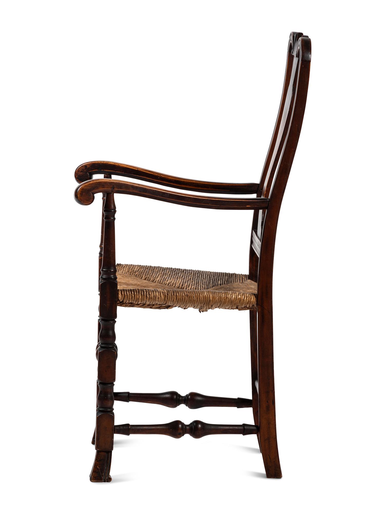 A Queen Anne Transitional Carved Maple Rush-Seat Spanish-Foot Armchair
