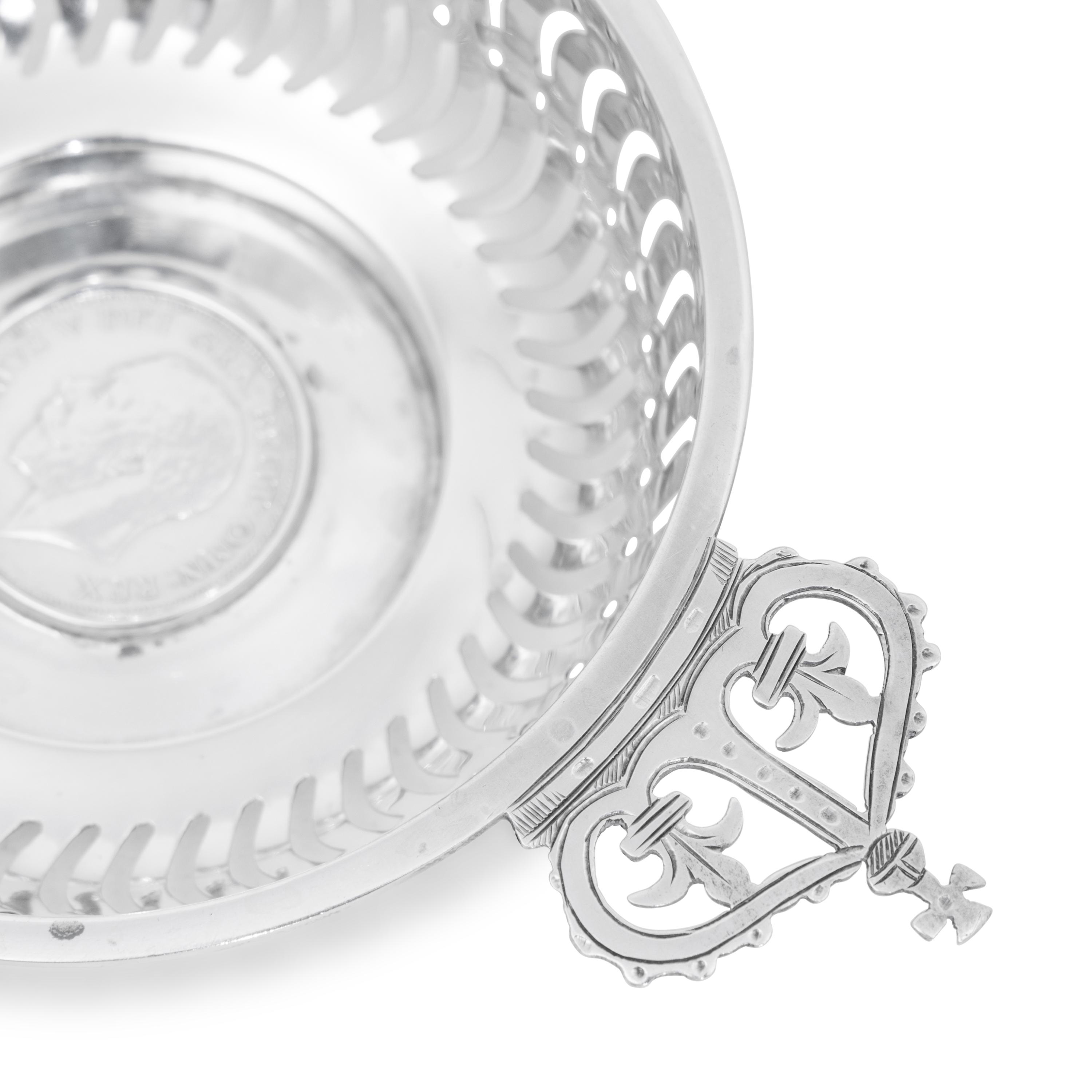 A Set of Four English Silver Coin-Inset Nut Dishes