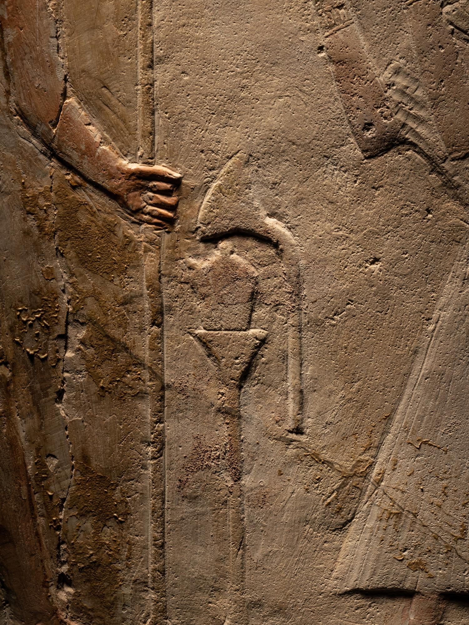 An Egyptian Limestone Round-Topped Stele