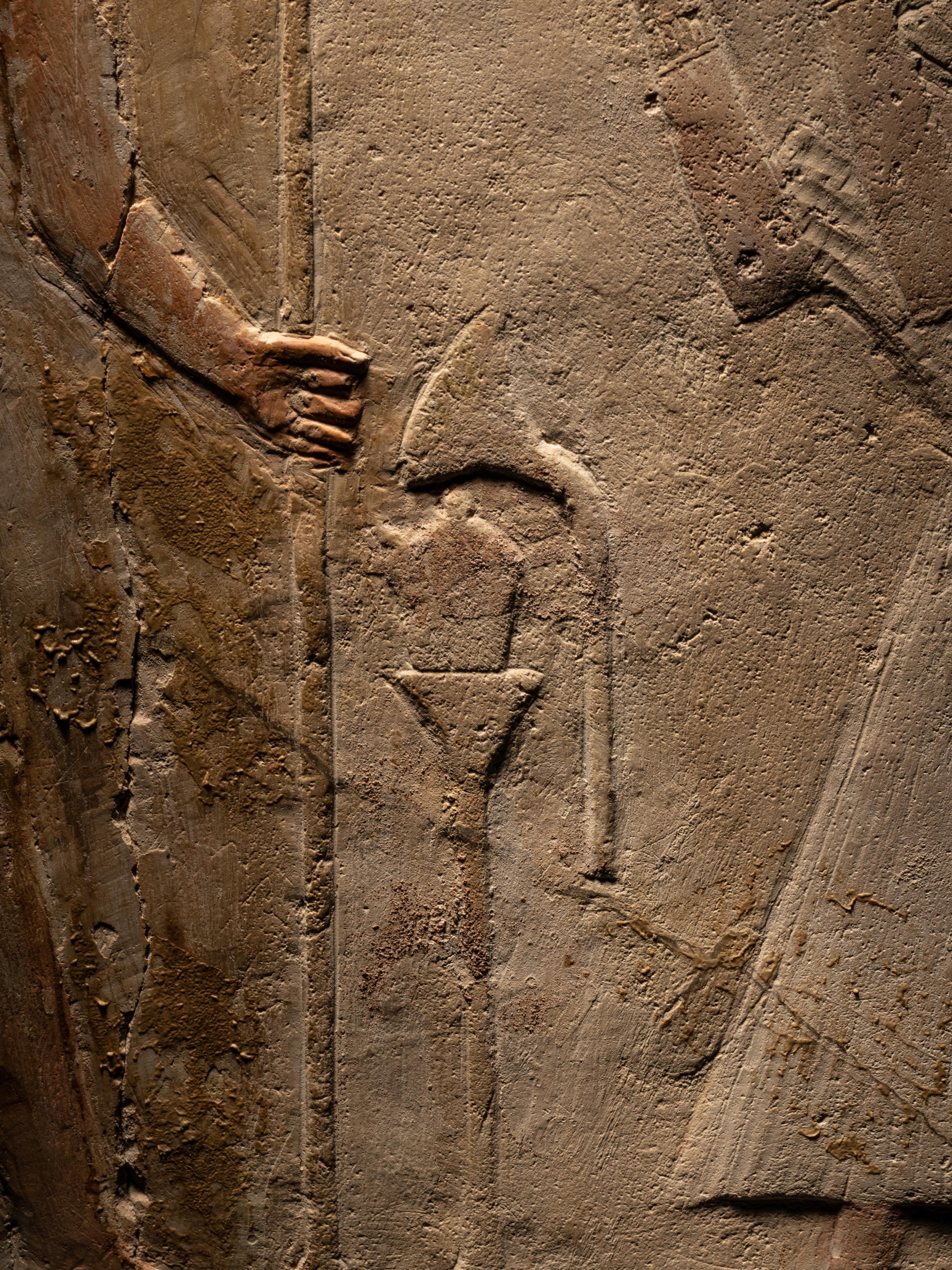 An Egyptian Limestone Round-Topped Stele