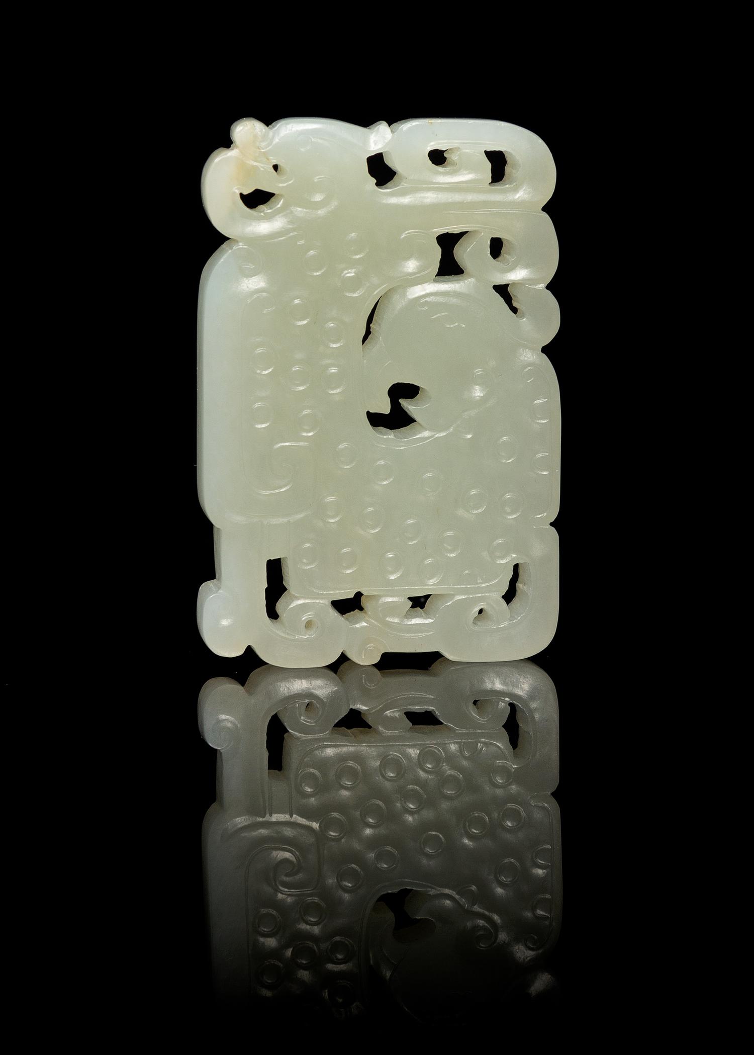 A Chinese Pierced Carved Jade Plaque 18TH/19TH CENTURY Length 2 3/8 inches. — 18TH/19TH CENTURY