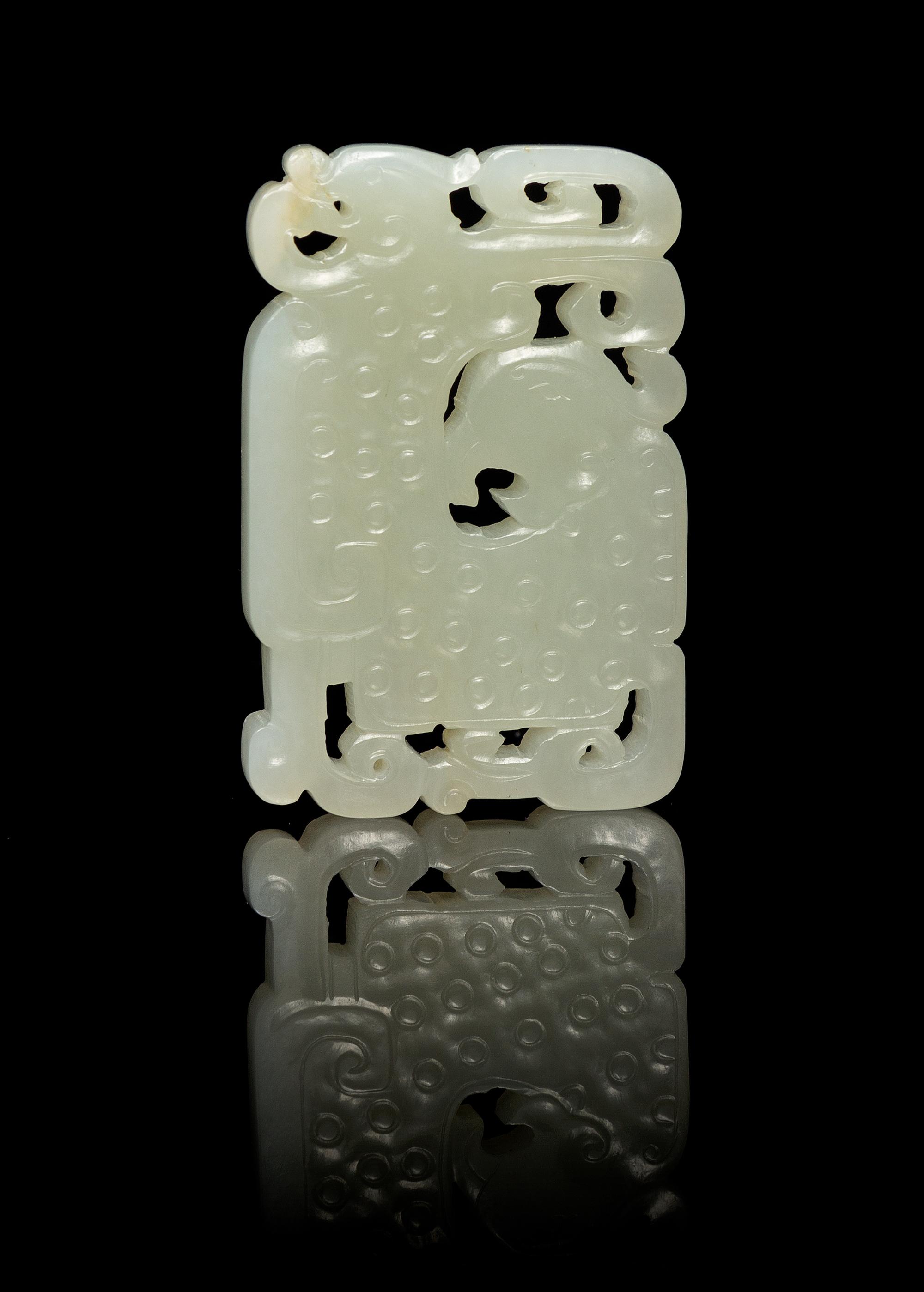 A Chinese Pierced Carved Jade Plaque 18TH/19TH CENTURY Length 2 3/8 inches. — 18TH/19TH CENTURY