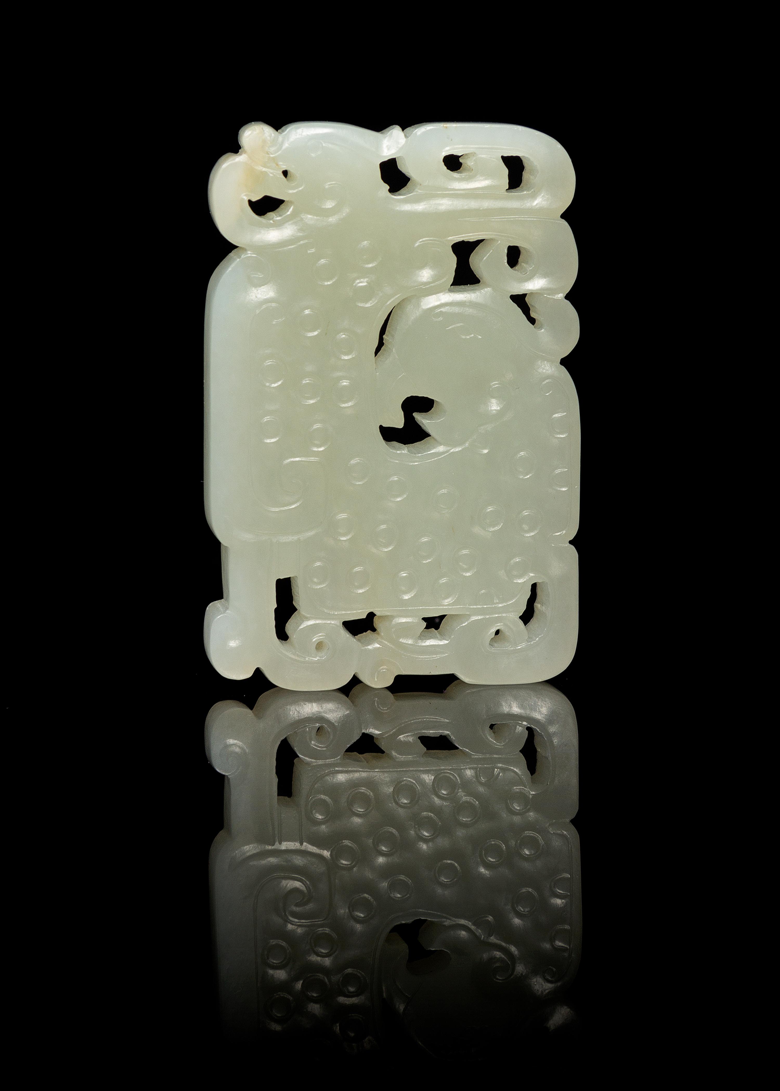A Chinese Pierced Carved Jade Plaque 18TH/19TH CENTURY Length 2 3/8 inches. — 18TH/19TH CENTURY