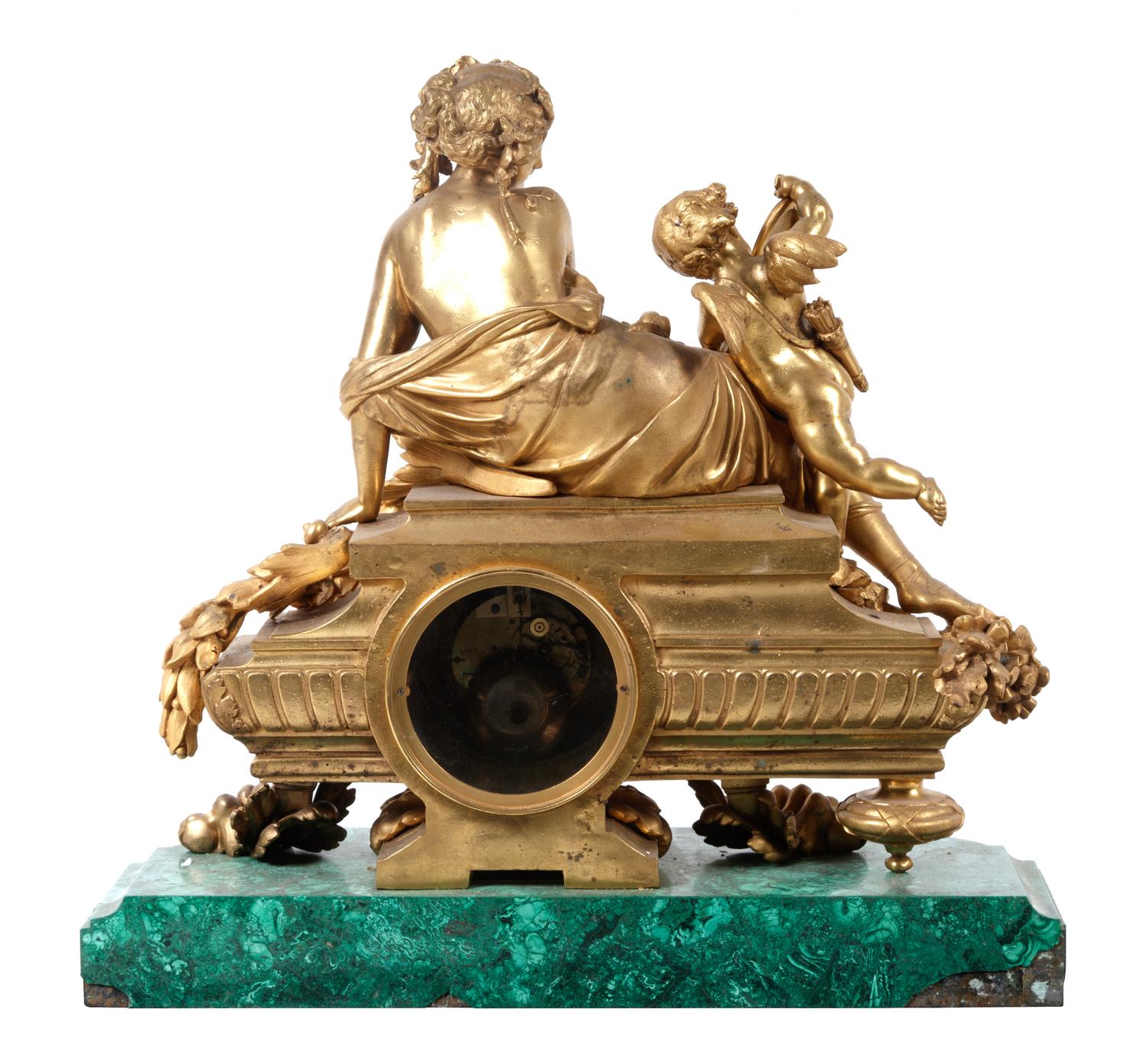 A Louis XV Style Gilt Metal Mounted Malachite Mantel Clock