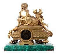 A Louis XV Style Gilt Metal Mounted Malachite Mantel Clock