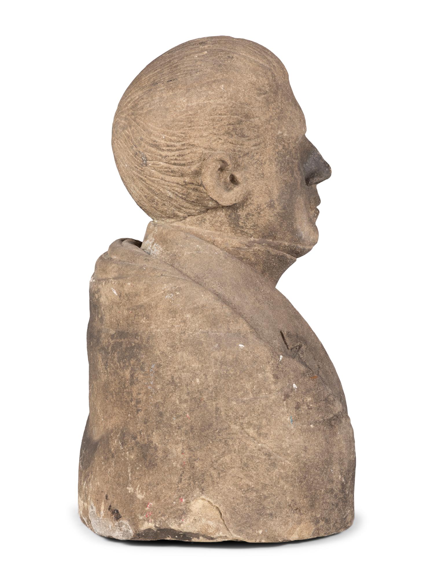 A Carved Stone Bust of a Gentleman