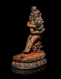 A Tibetan or Bhutanese Polychromed Wood Figure of Chakrasamvara and Consort