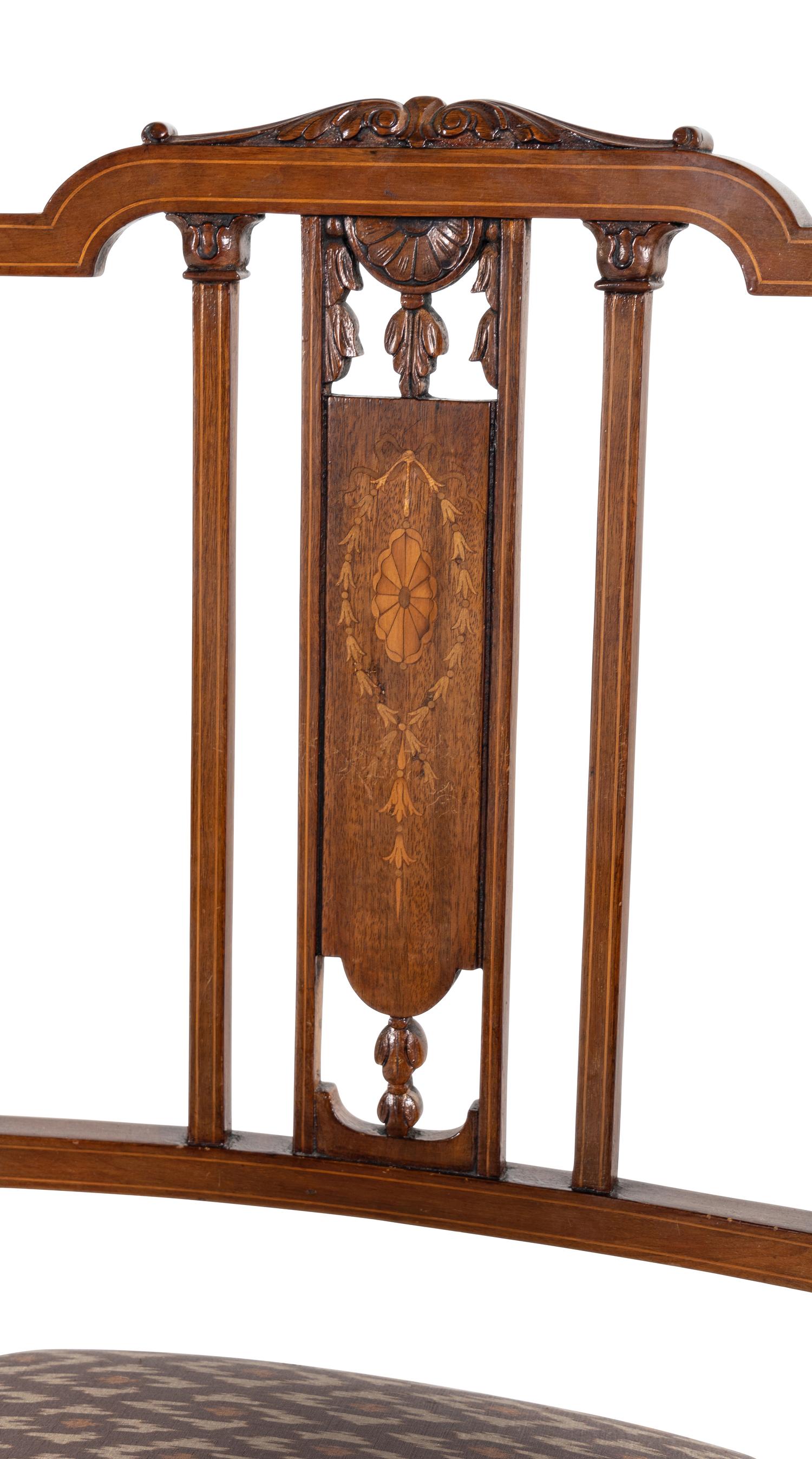 A Pair of Edwardian Mahogany and Marquetry Armchairs