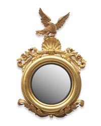 A Classical Carved and Giltwood Bull's Eye Mirror