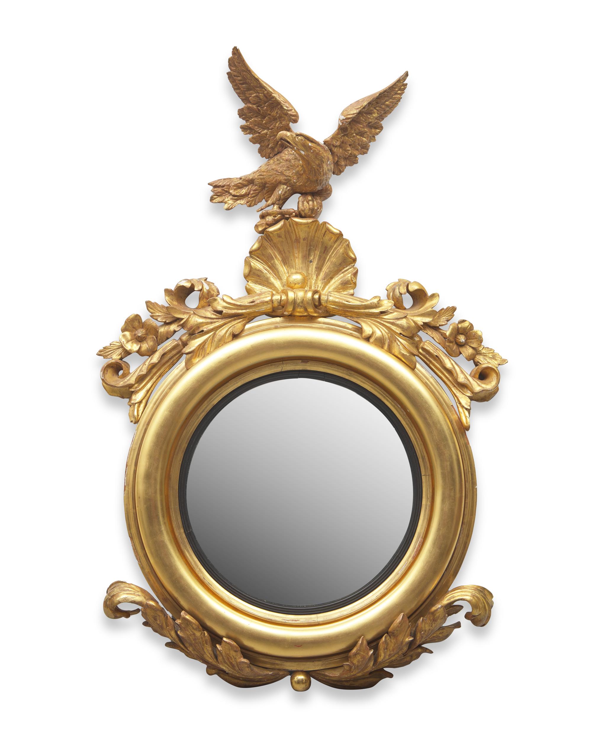 A Classical Carved and Giltwood Bull's Eye Mirror