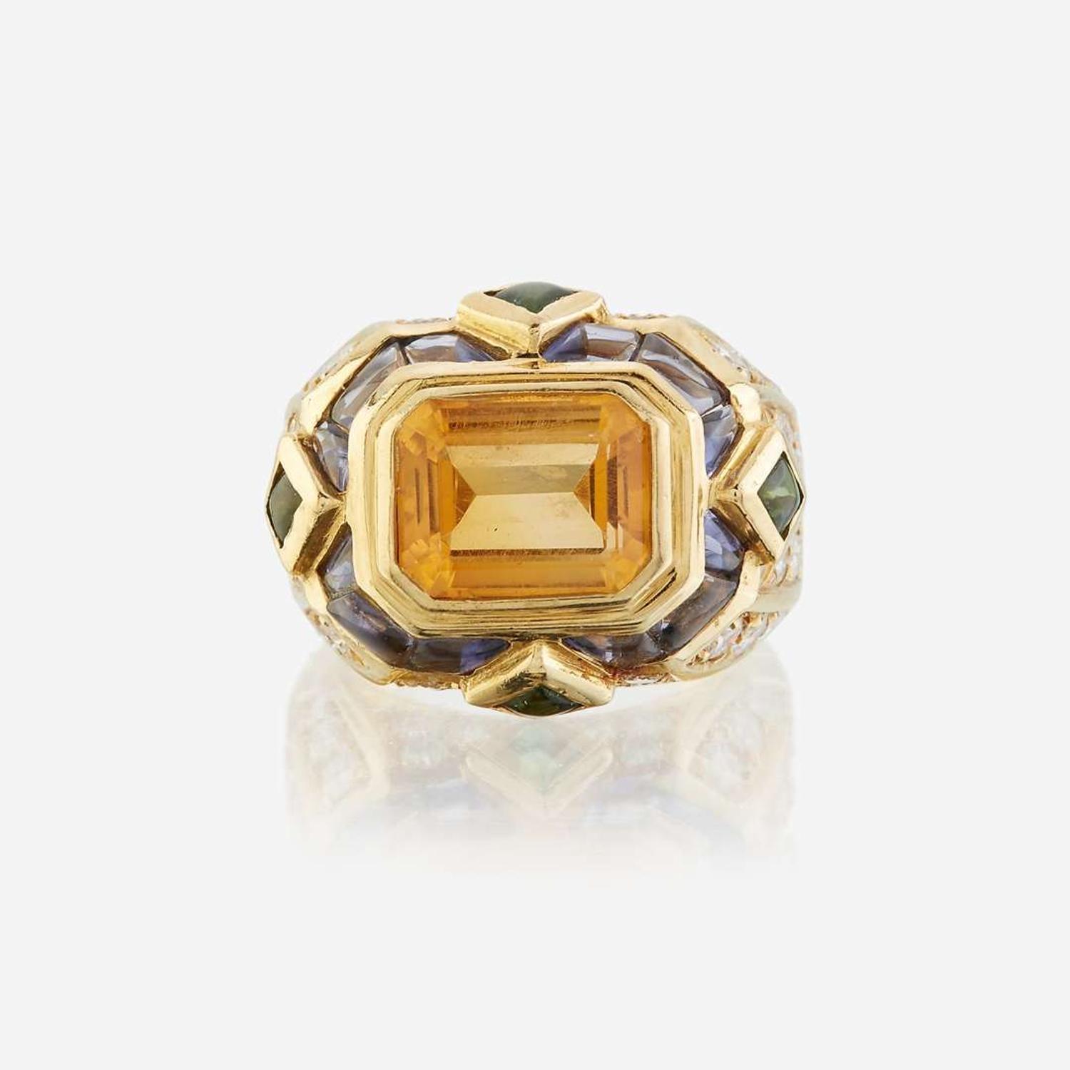 A citrine, diamond, sapphire, peridot, and eighteen karat gold ring